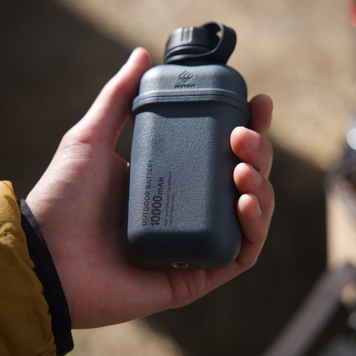 grey blue outdoor battery with 10000mah of energy - rechargeable portable power bank for the outdoors 